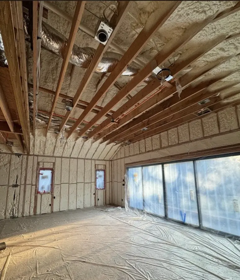 Interior walls and ceiling insulated with spray foam during new construction in Woodburn